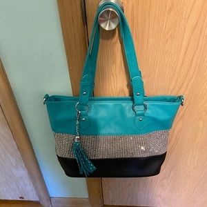 Tq with strip of black & silver handbag